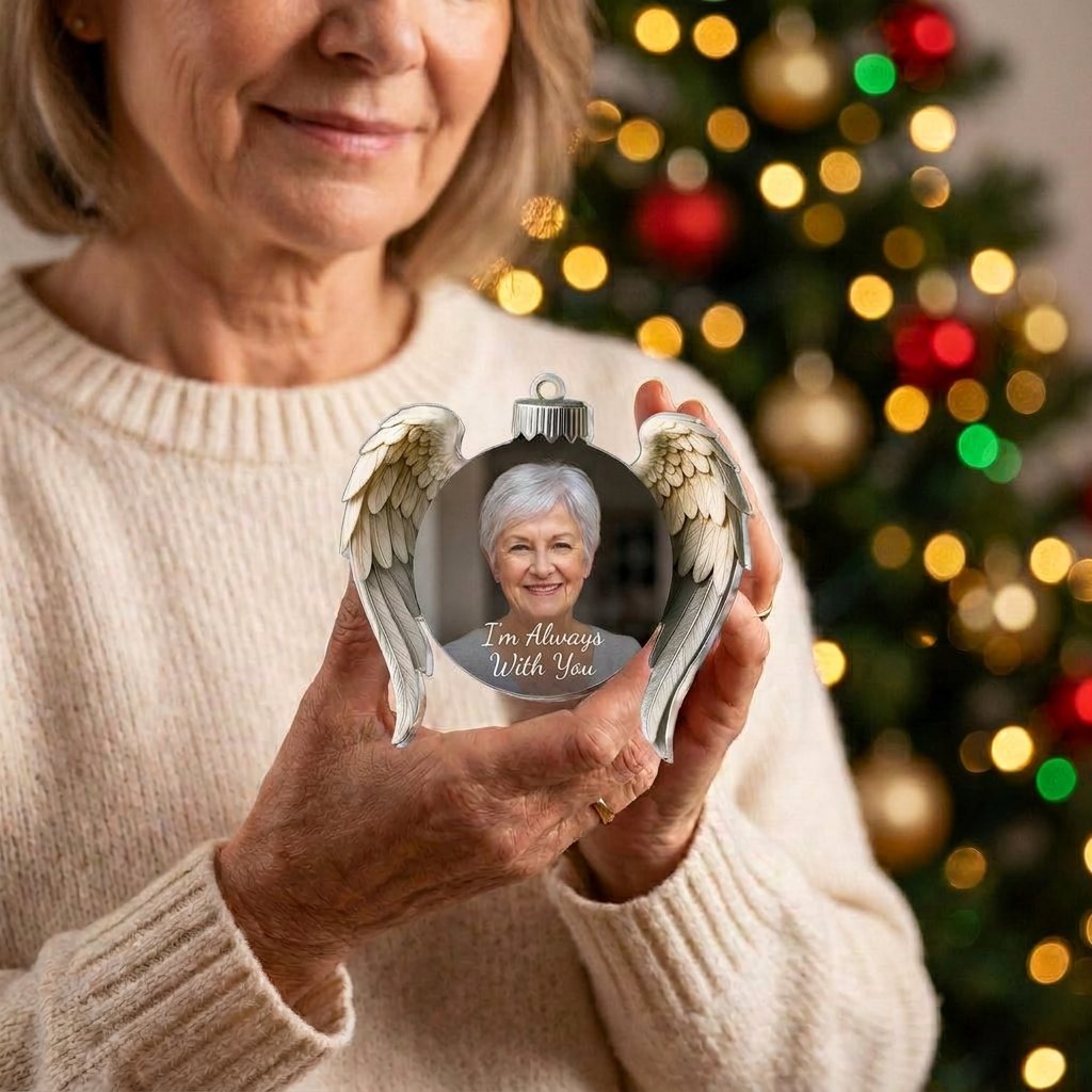 A woman holding the Always Near Ornament