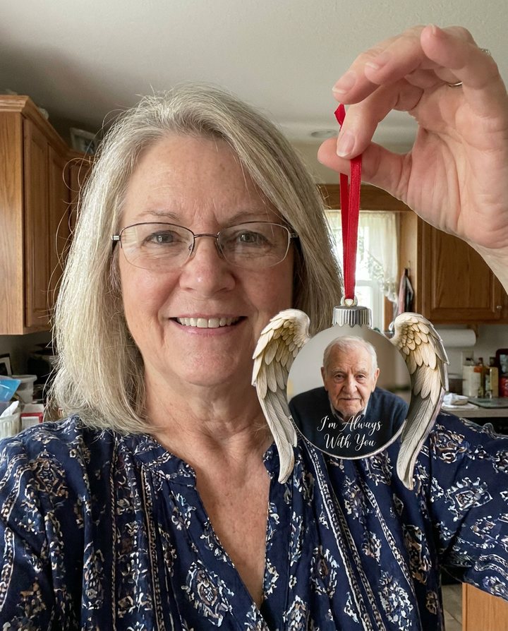 A customer with the Always Near Ornament