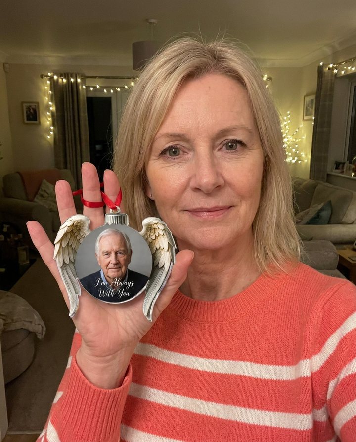 A customer with the Always Near Ornament